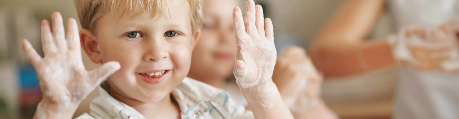 boy with soapy hands