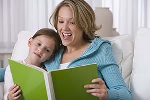 woman reading to young girl