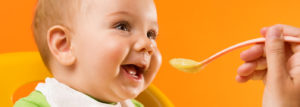 wic thumbnail feeding baby with a spoon